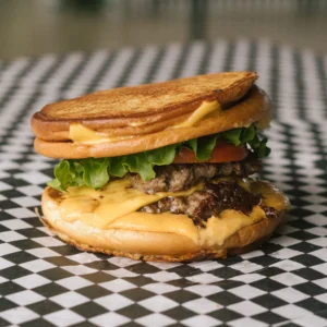 an interrogator burger on a black and white checkered surface