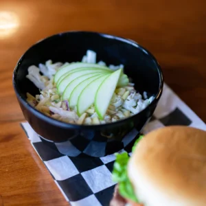 a bowl of coleslaw on a table